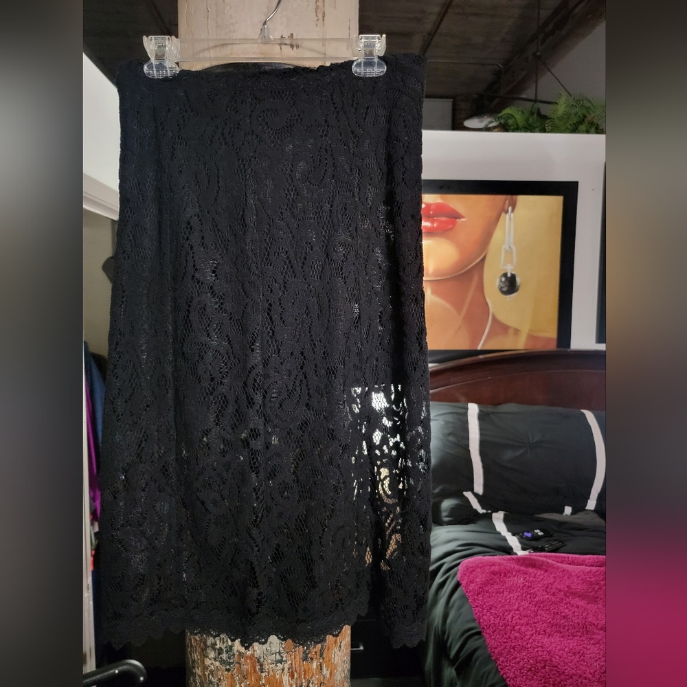 FP Blk Lace Midi Skirt has a lining only from the waist to the thigh